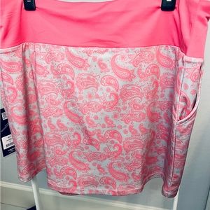 Head brand golf skort. Size XL. Salmon and taupe colored.